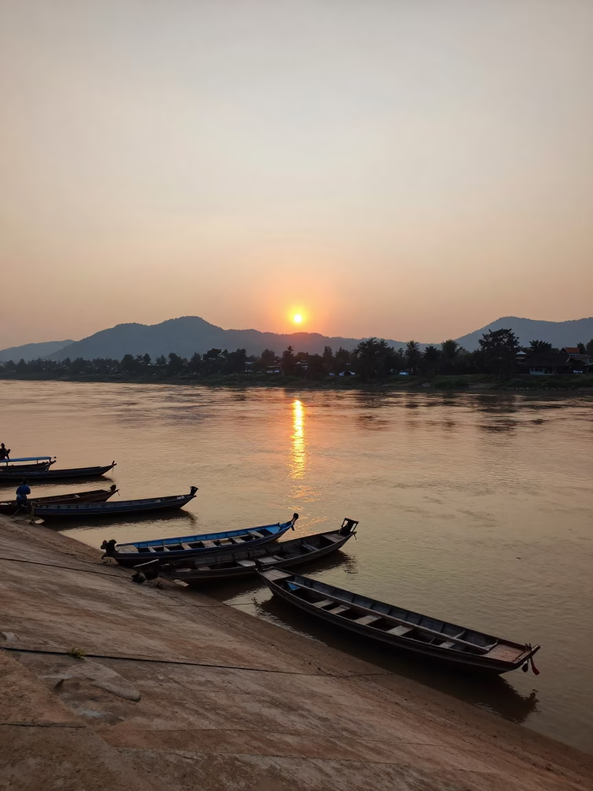 Sunset in Luang Prabang at As The Sun Drops Toward The Horizon in in Luang Prabang, Laos
