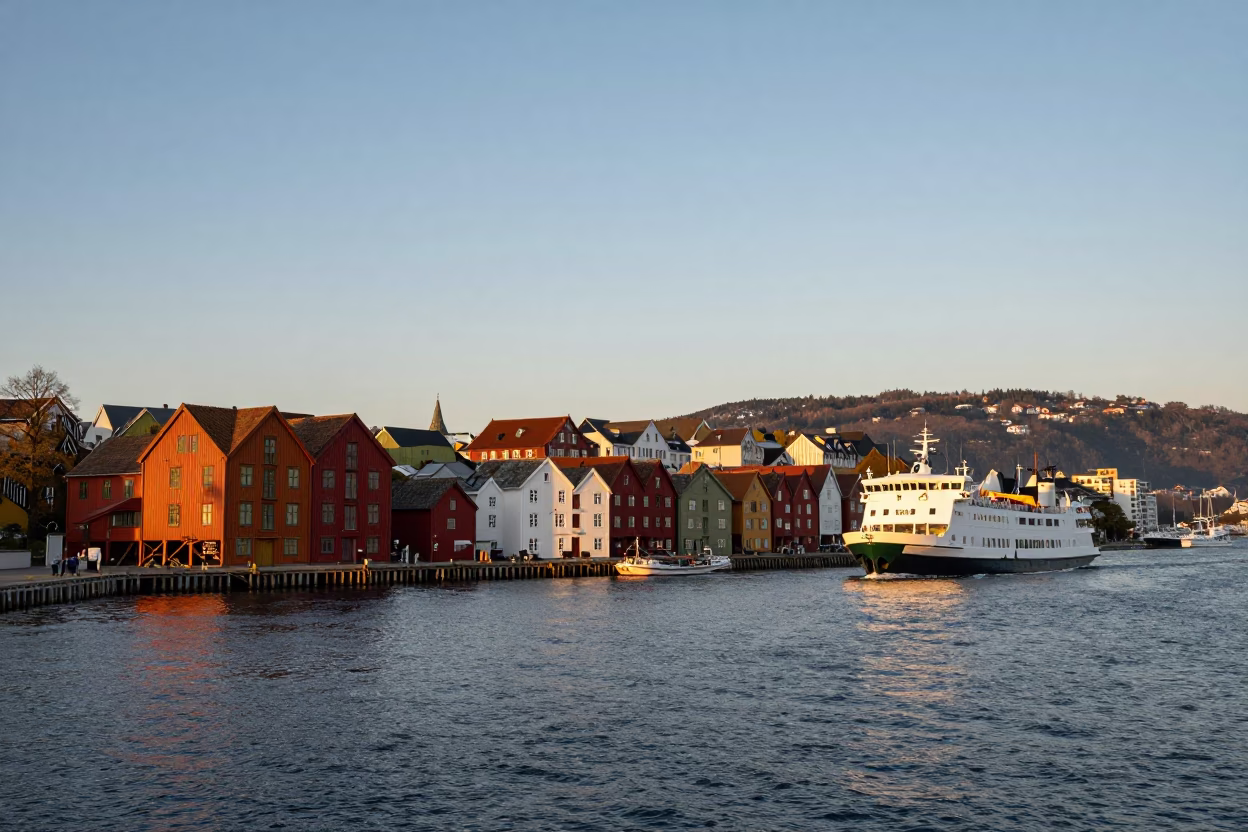 Sunset Light on Bergen Norway Harbor Waterfront with Ferry and Traditional Colorful Houses in in Bergen, Norway