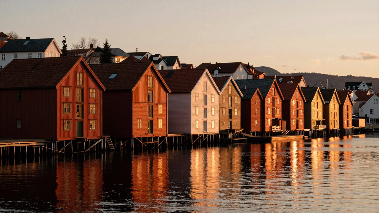 Sunset Light on Bergen Norway Wharf Houses and Fjord Reflections in in Bergen, Norway