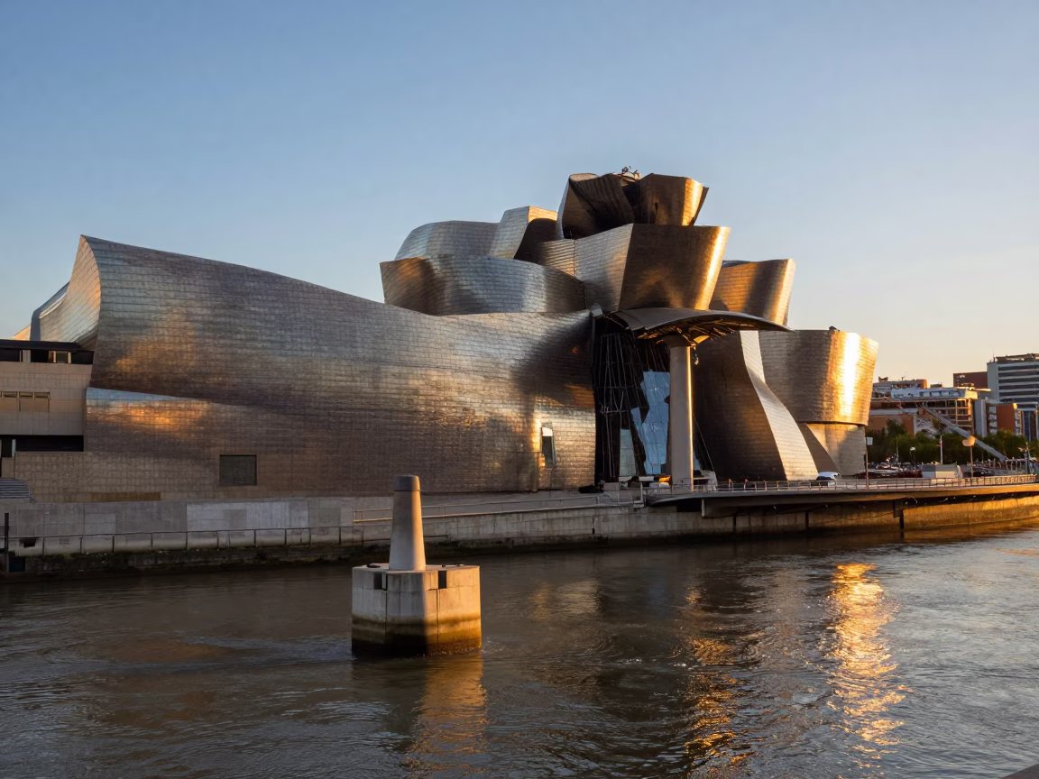 Sunset Light on Guggenheim Bilbao Bridge Pier and Urban Waterfront Scene in in Bilbao, Spain