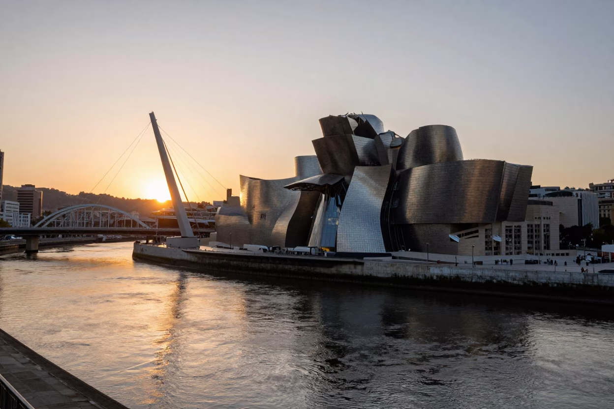 Sunset Over Bilbao Nervión River with Modern Architecture and Urban Life in in Bilbao, Spain