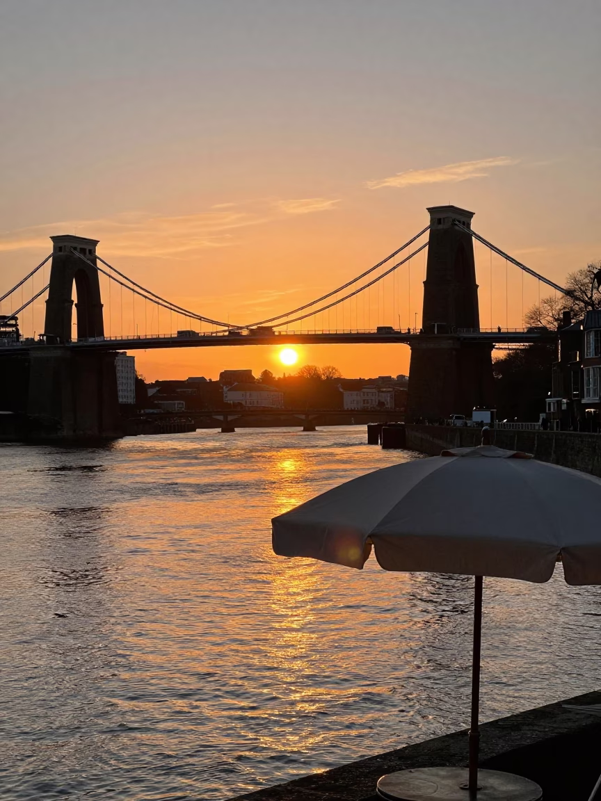 Sunset Over Bristol Harbour With Ripples And Vintage Umbrella Stand in in Bristol, United Kingdom