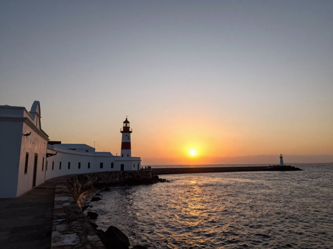 Sunset Over Cartagena Colombia Harbor Breakwater and Lighthouse Beacon in in Cartagena, Colombia