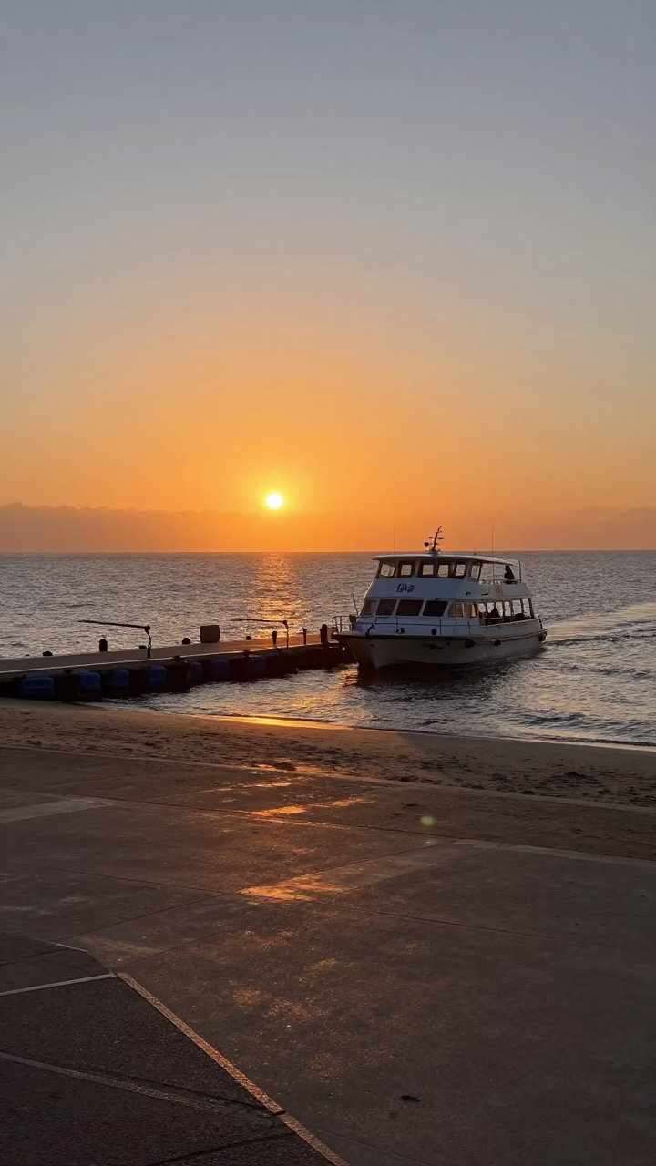 Sunset Over Durban Beachfront With Water Taxi Docking at Golden Hour in in Durban, South Africa
