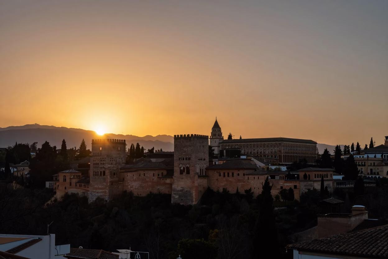 Sunset Over Granada Spain Alhambra Palace Silhouette and City Rooftops in in Granada, Spain