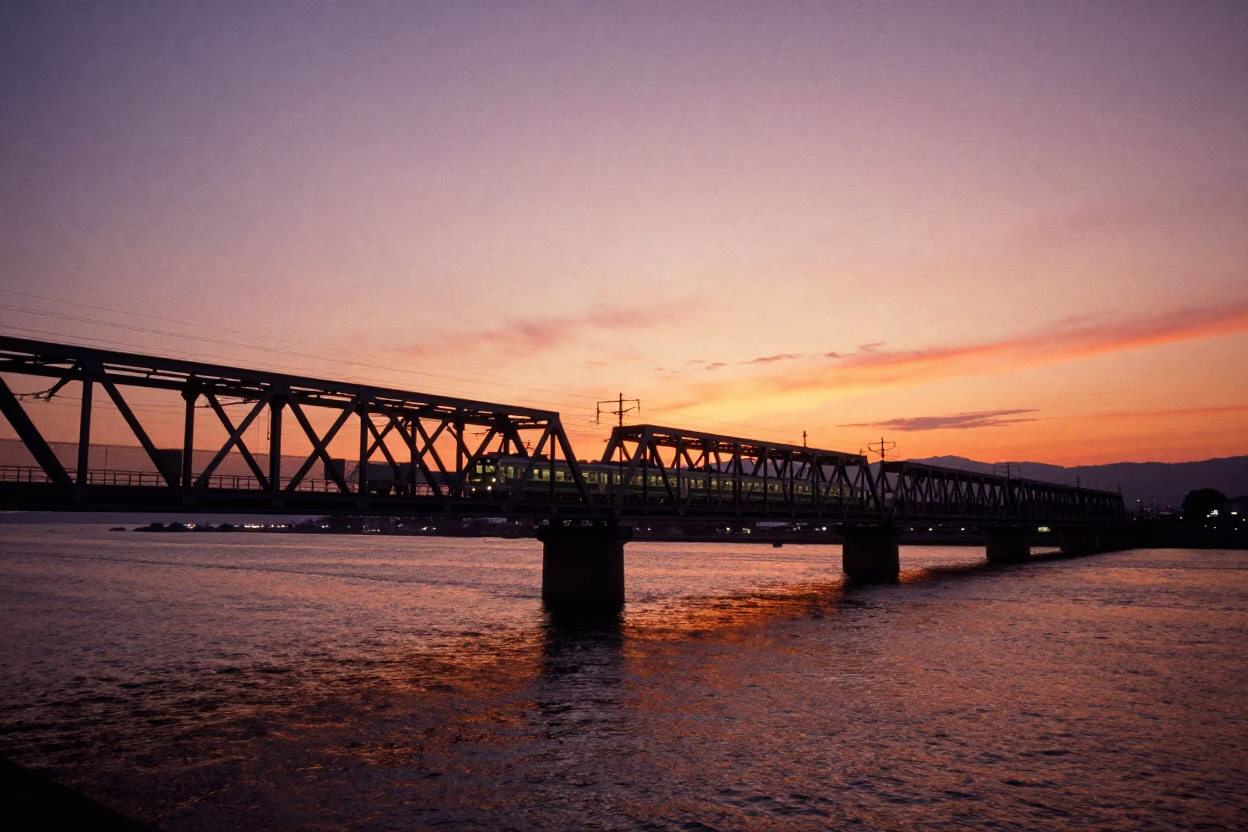 Sunset Over Hakata Bay Commuter Train Crossing Bridge in Fukuoka Japan in in Fukuoka, Japan