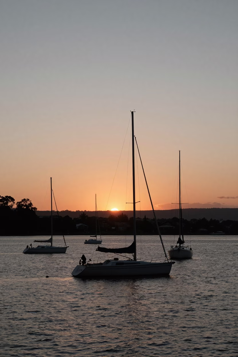 Sunset over Hobart Waterfront with Derwent River and Sailing Yachts in in Hobart, Tasmania, Australia