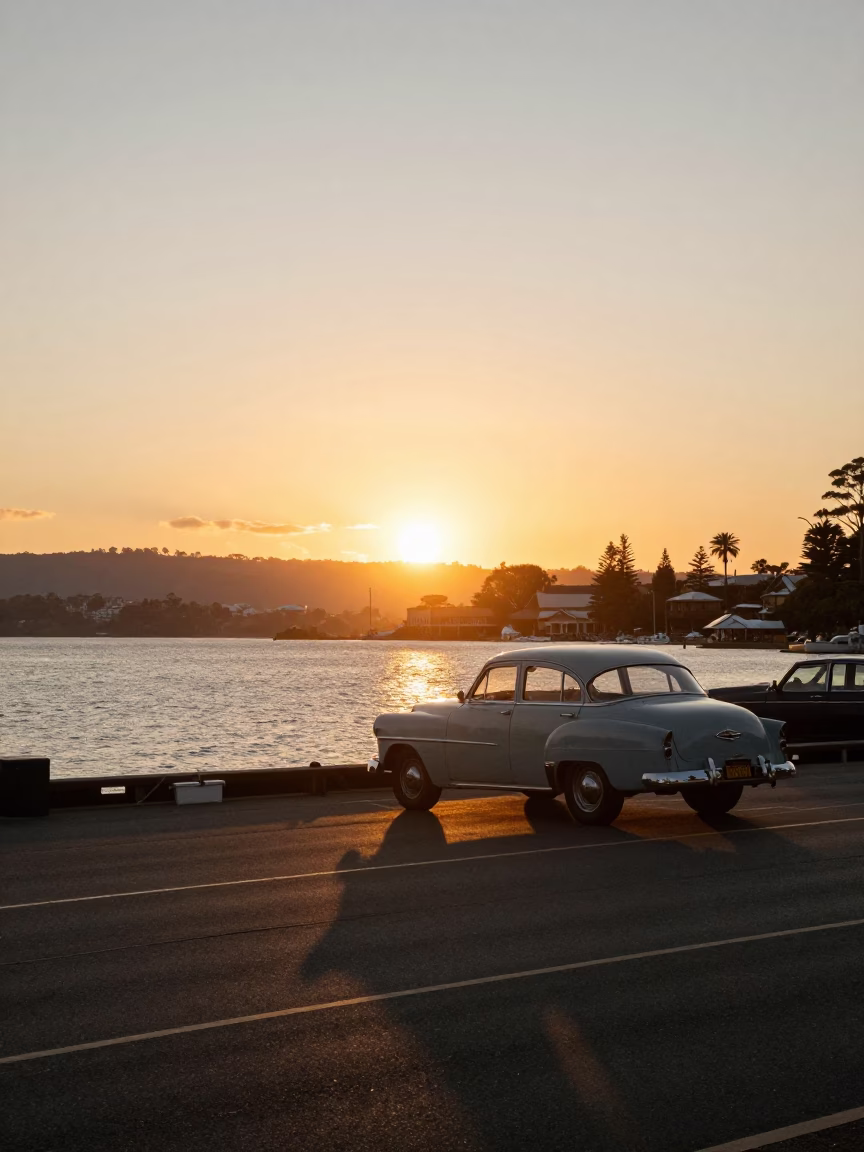 Sunset over Hobart Waterfront with Vintage Cars and Tasmanian Harbor Views in in Hobart, Tasmania, Australia