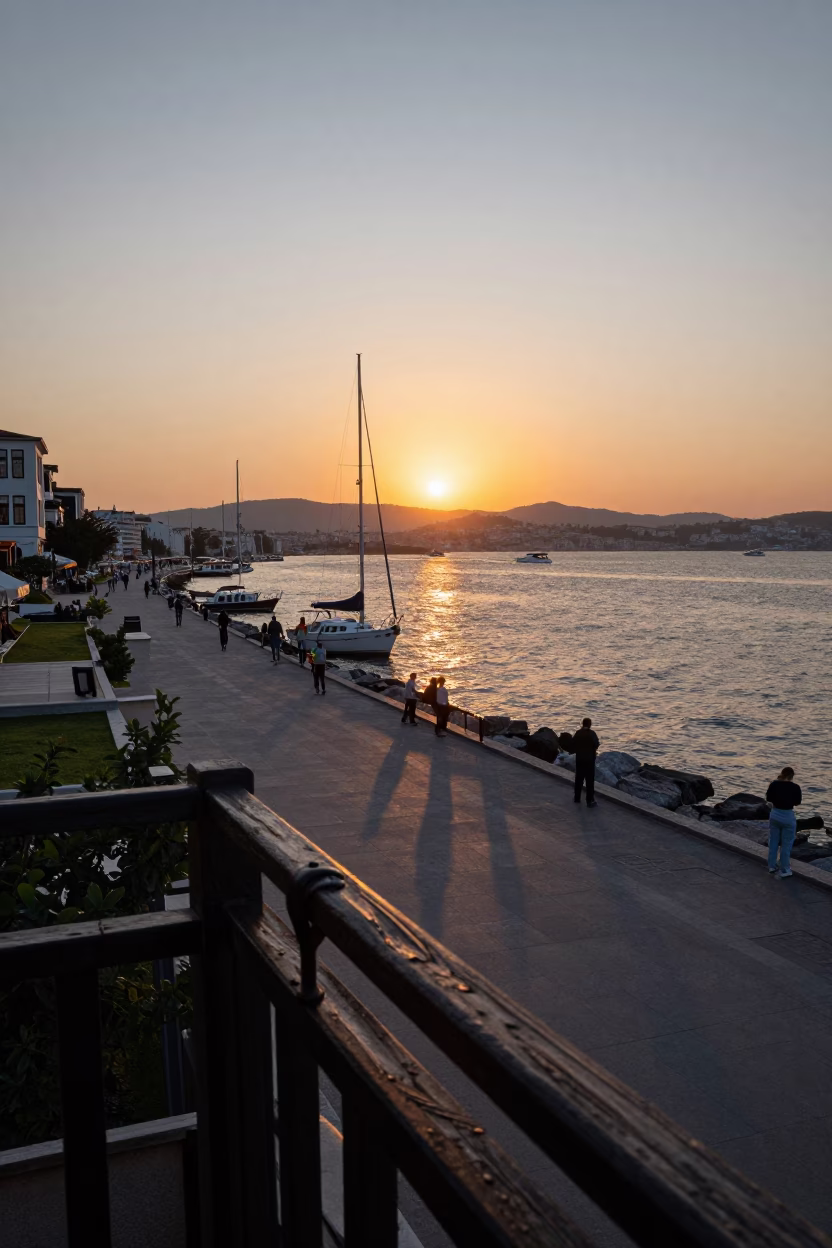 Sunset Over Izmir Kordon Promenade With Sailboats and Historic Ottoman Architecture in in Izmir, Turkey