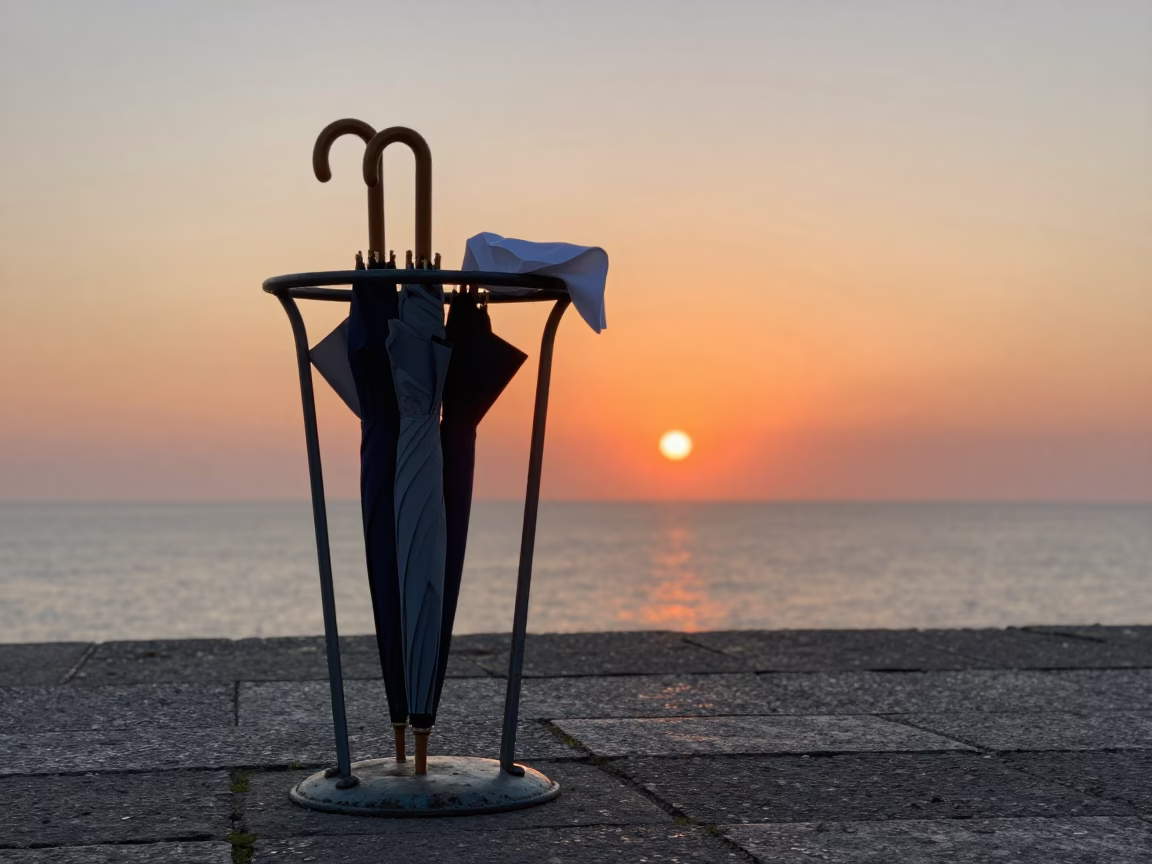 Sunset over Nice France with Umbrella Stand and Handkerchief on Promenade in in Nice, France