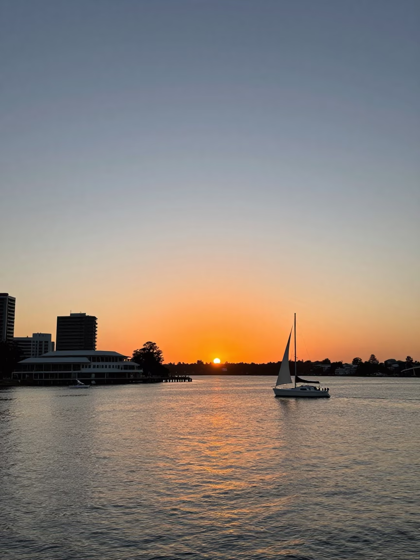 Sunset over Perth Swan River with Yacht Club and City Skyline in in Perth, Western Australia, Australia