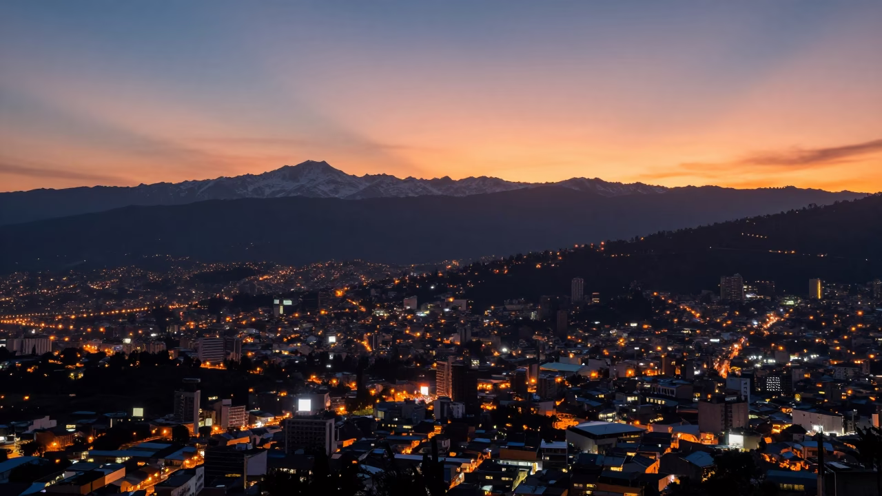 Sunset over Quito Ecuador Andes mountains and city lights in in Quito, Ecuador