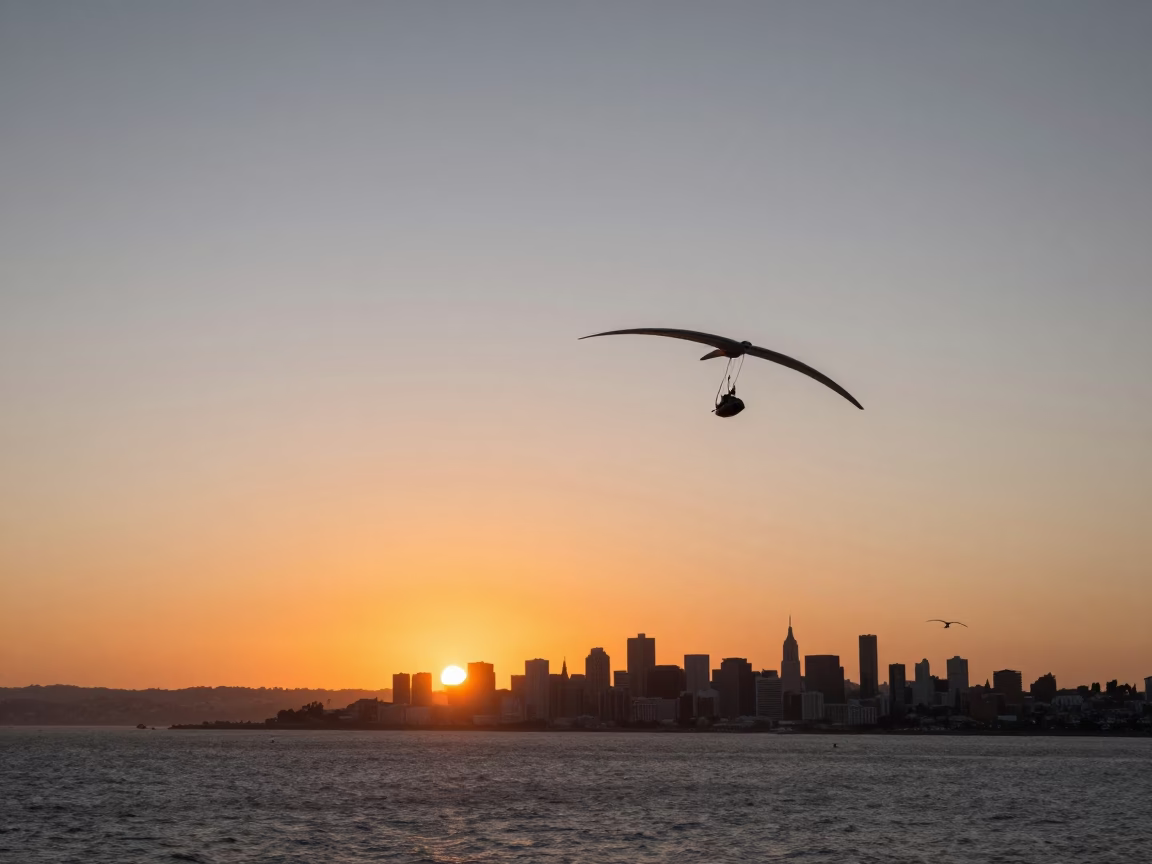 Sunset over San Francisco Bay with Glider and Urban Skyline in in San Francisco, California, United States
