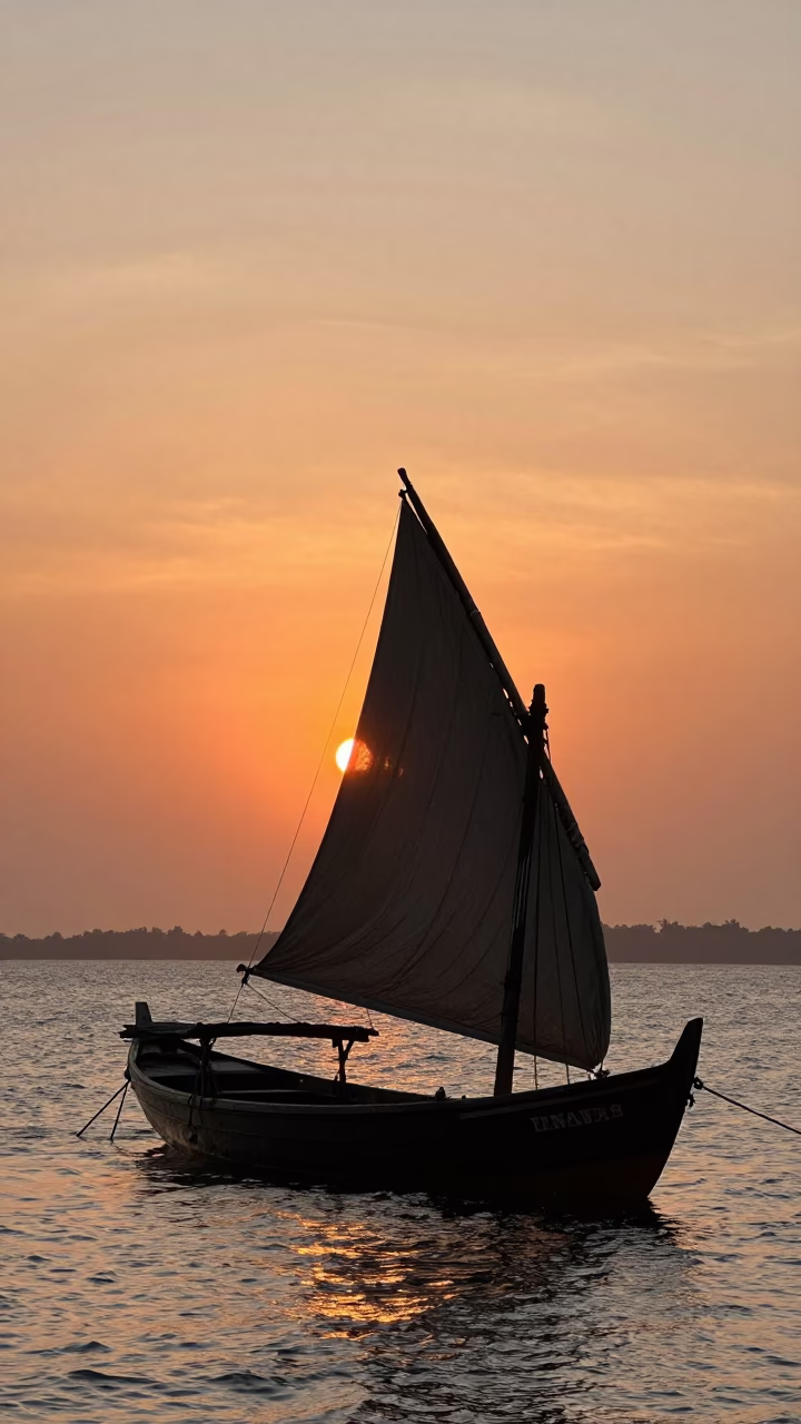 Sunset Silhouette of Traditional Dhow Boat with Lateen Sail on Chennai Coastline in in Chennai, India