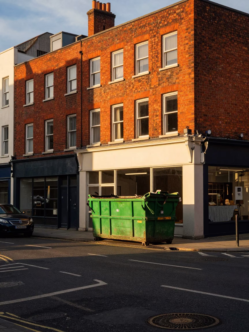 Sunset Street Scene in Bristol UK with Demolition Dumpster and Urban Decay in in Bristol, United Kingdom