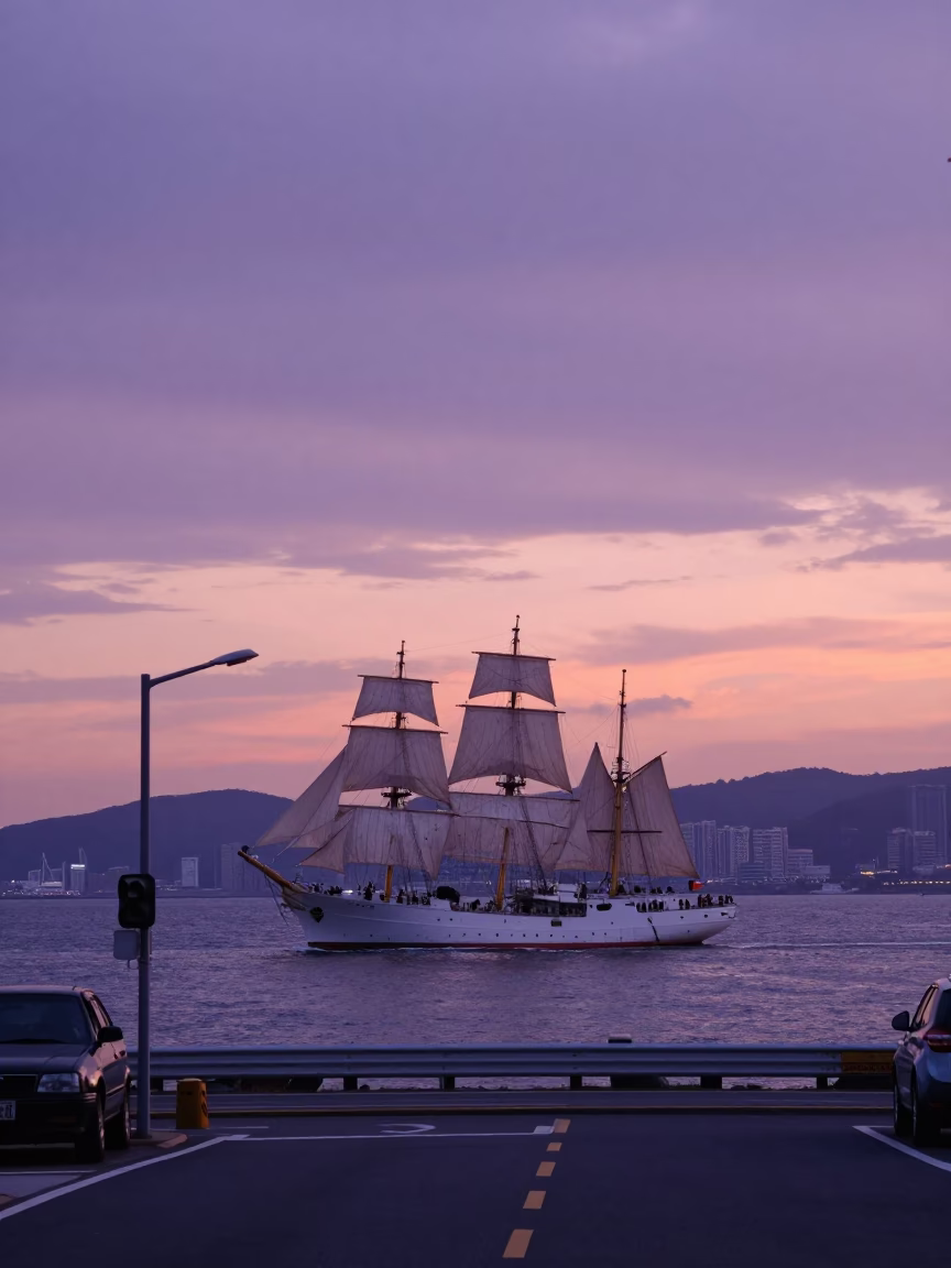 Sunset street scene in Busan South Korea with tall ship entering the bay in in Busan, South Korea