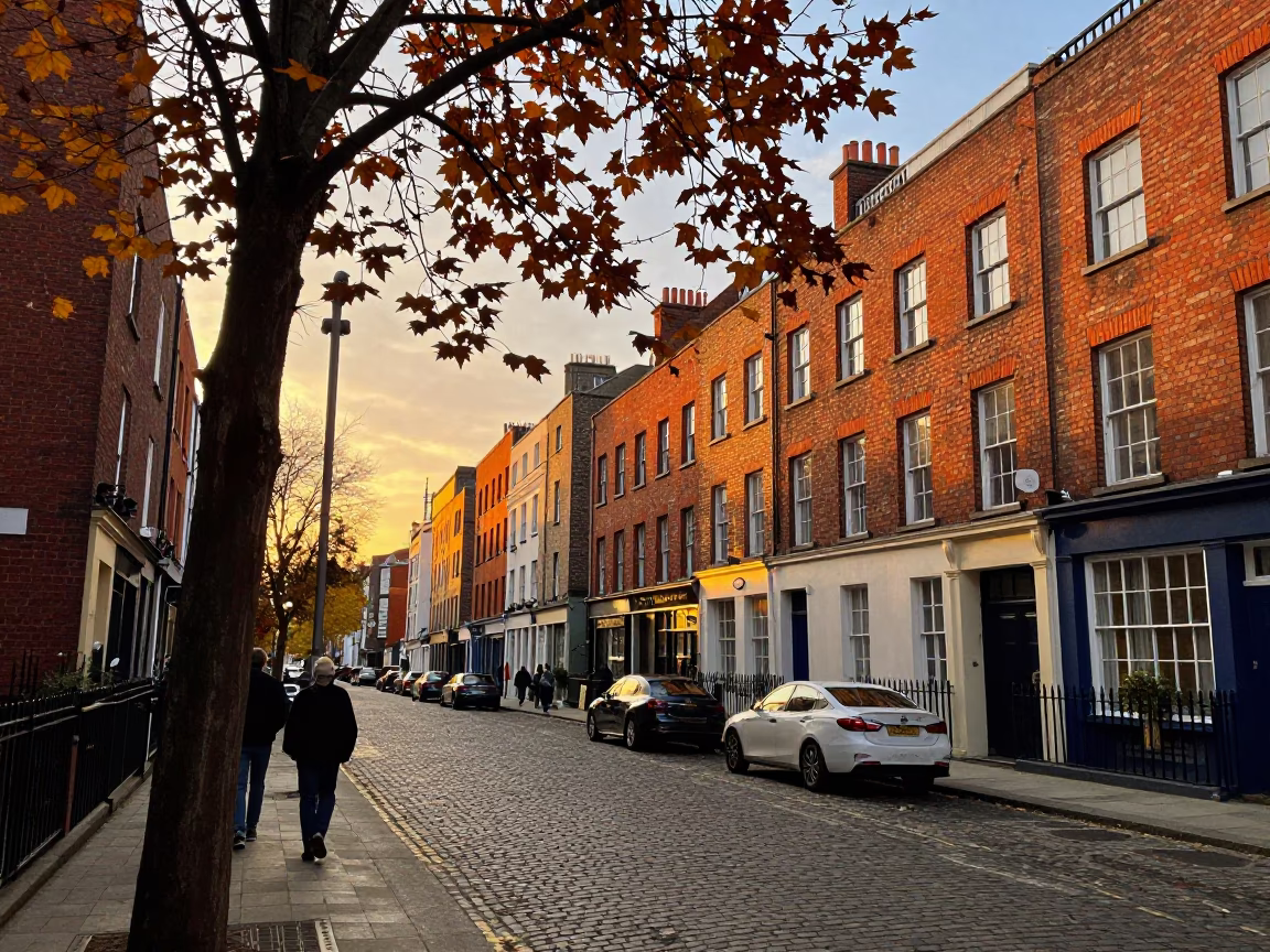 Sunset Street Scene in Dublin Ireland with Autumn Leaves and Local Pedestrians in in Dublin, Ireland