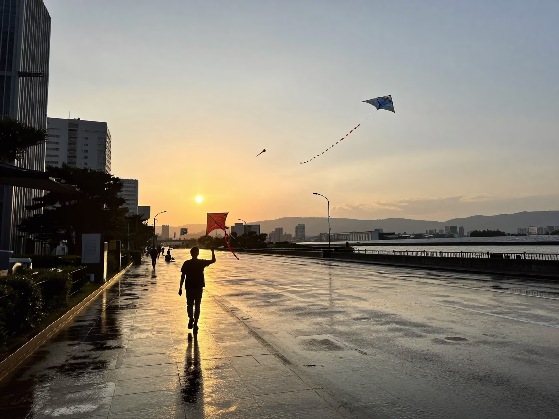 Sunset street scene in Fukuoka Japan with rain puddles and kites in in Fukuoka, Japan