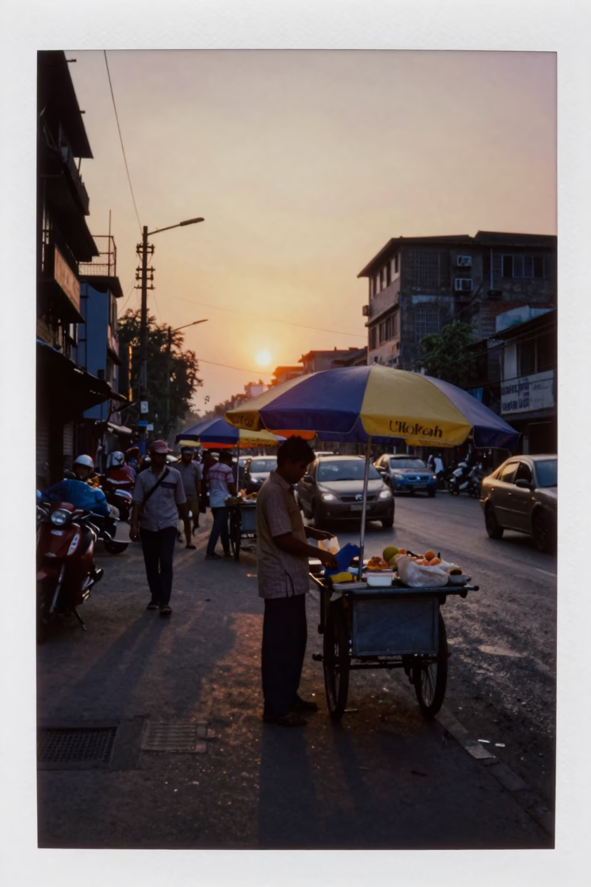 Sunset Street Scene in Kolkata India with Vendor and Umbrellas in in Kolkata, India