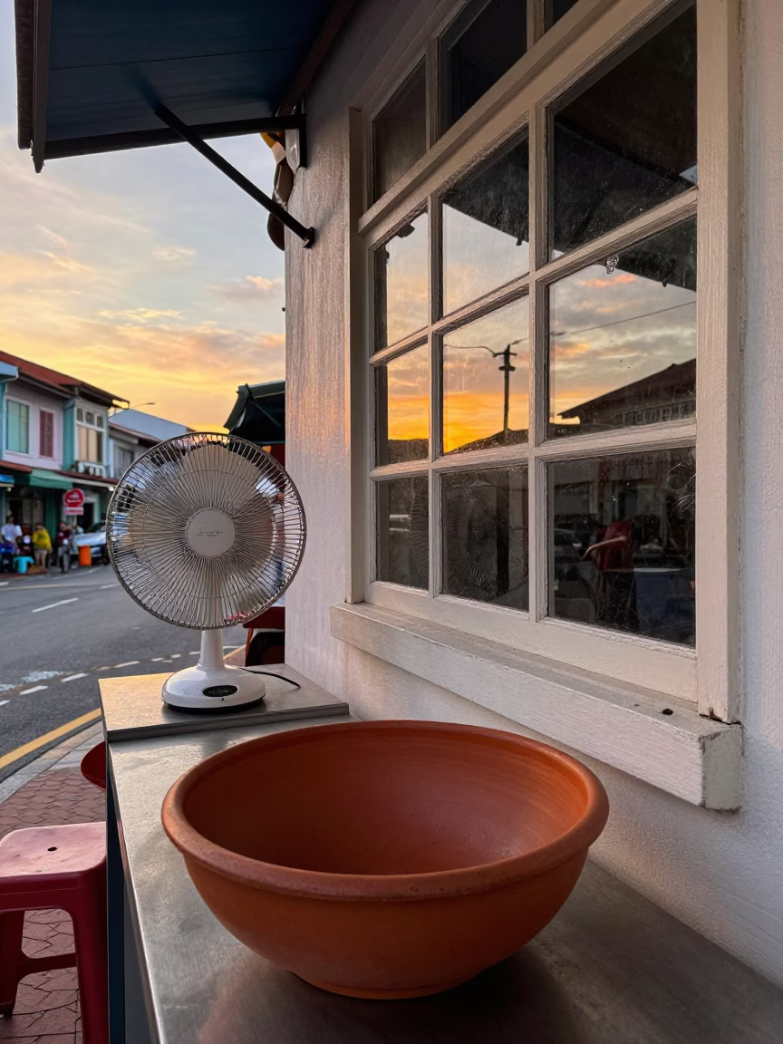 Sunset Street Scene in Singapore with Terracotta Bowl and Window Fan in in Singapore, Singapore