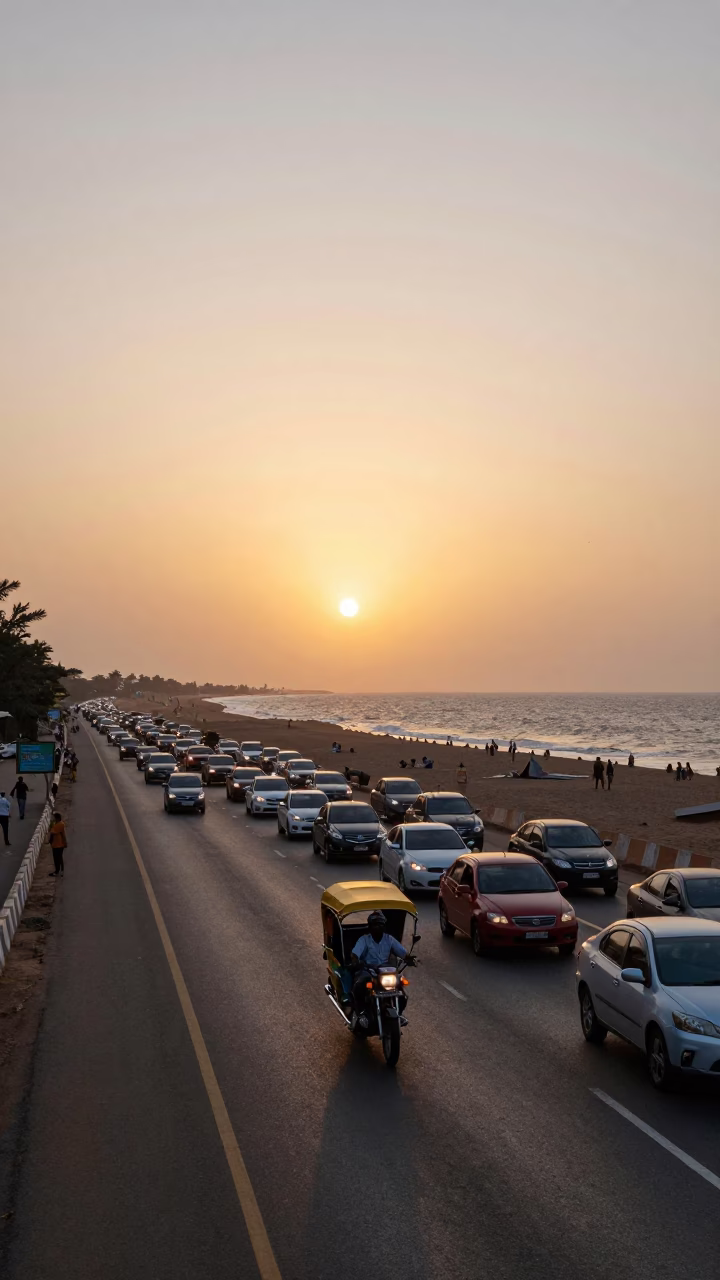 Sunset Traffic on Accra Coastal Highway with Motorcycle Taxi and Local Vendors in in Accra, Ghana