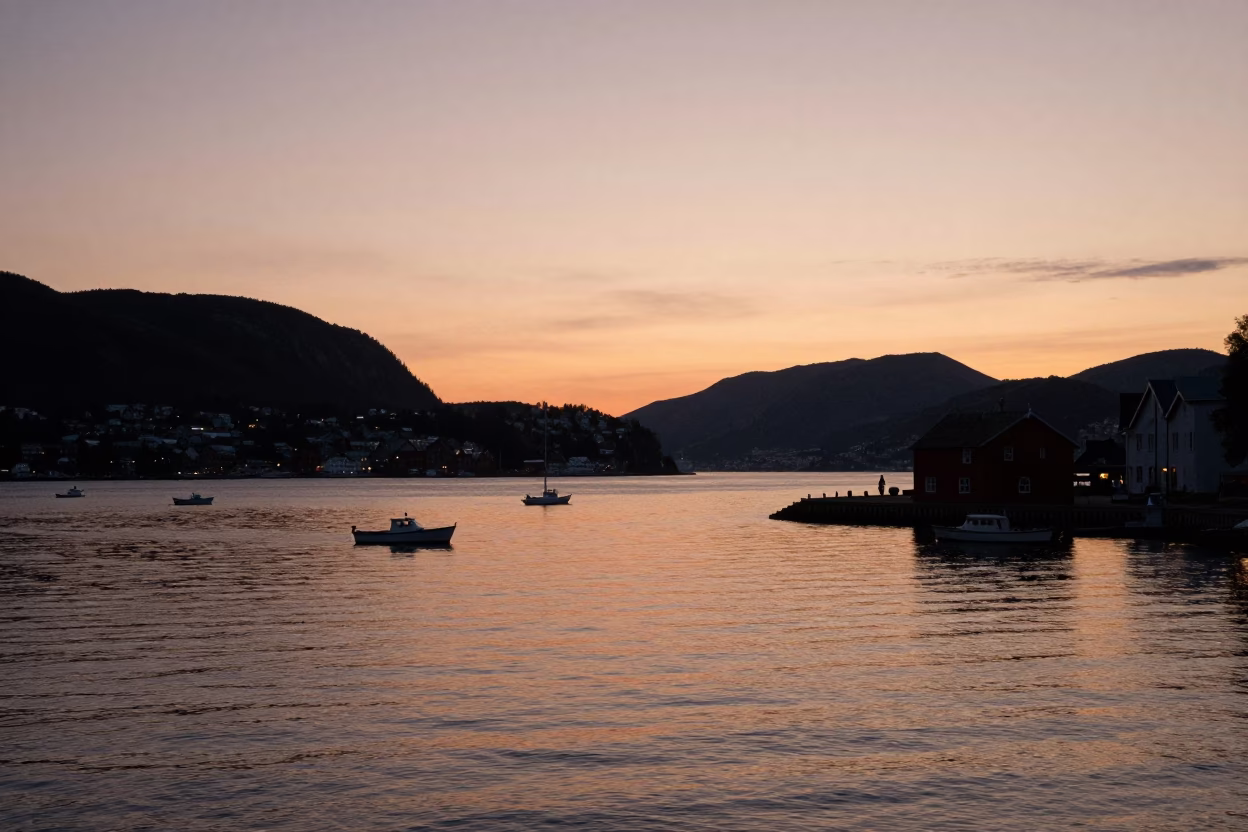 Sunset View of Bergen Norway Harbor Waters and Mountain Silhouettes in in Bergen, Norway