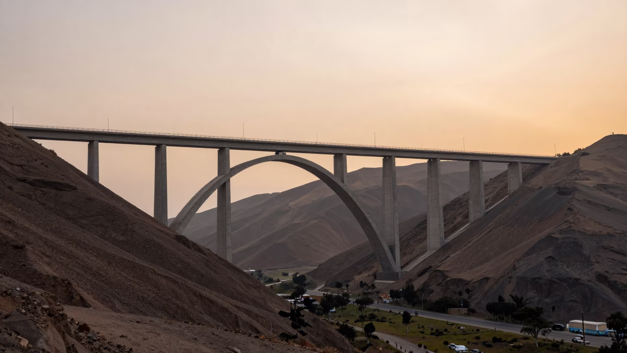 Sunset View of Curving Concrete Viaduct Over Lima Valley with Urban Landscape in in Lima, Peru