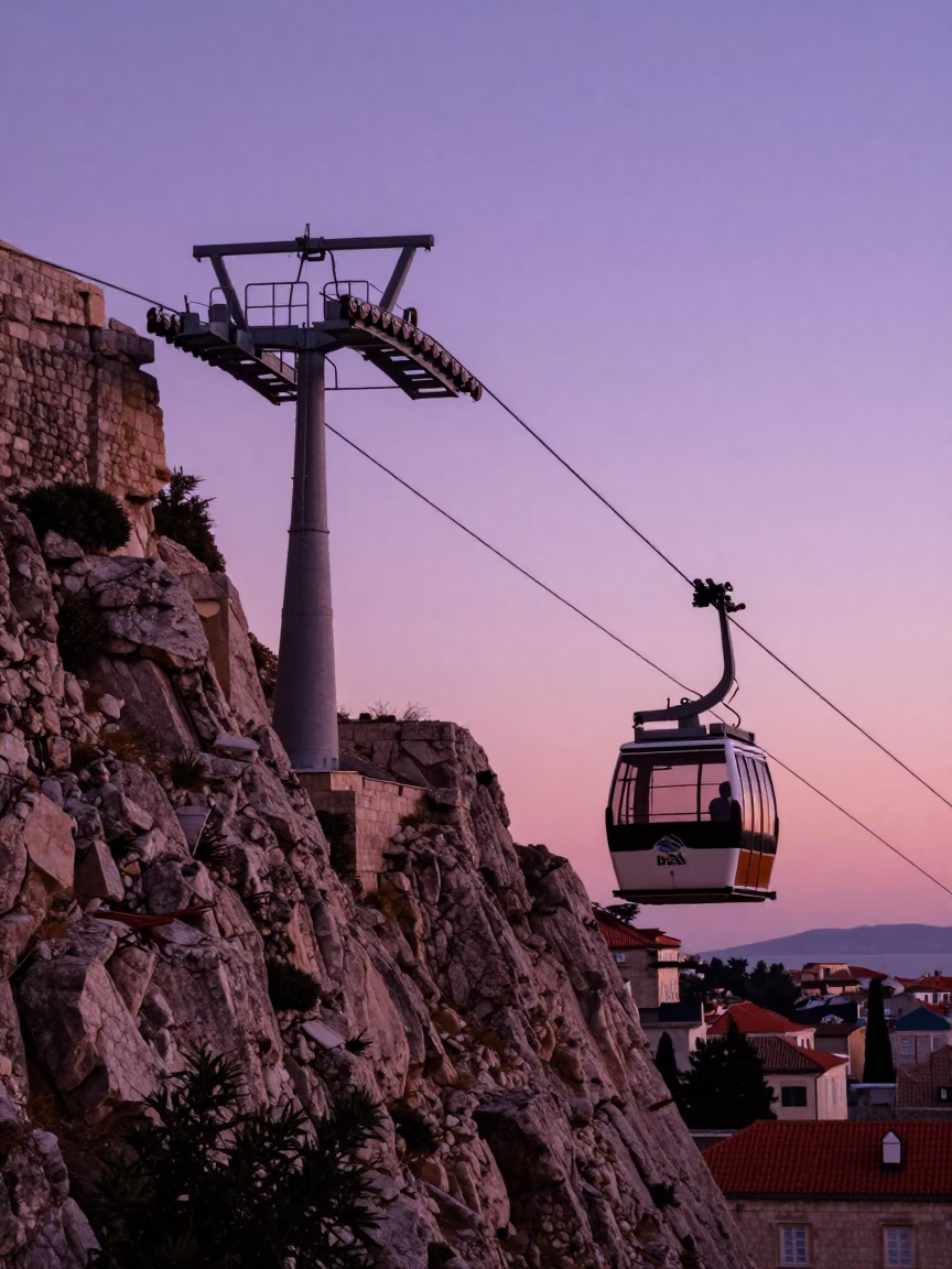 Sunset View of Dubrovnik Funicular Climbing Hillside Near Old City Walls in in Dubrovnik, Croatia