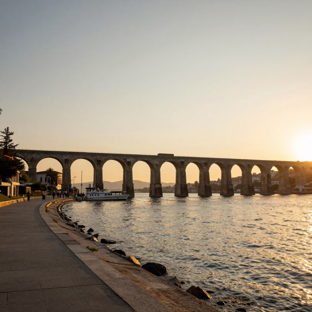 Sunset View of Izmir Bay with Ottoman Aqueduct Arcades and Coastal Traffic in in Izmir, Turkey