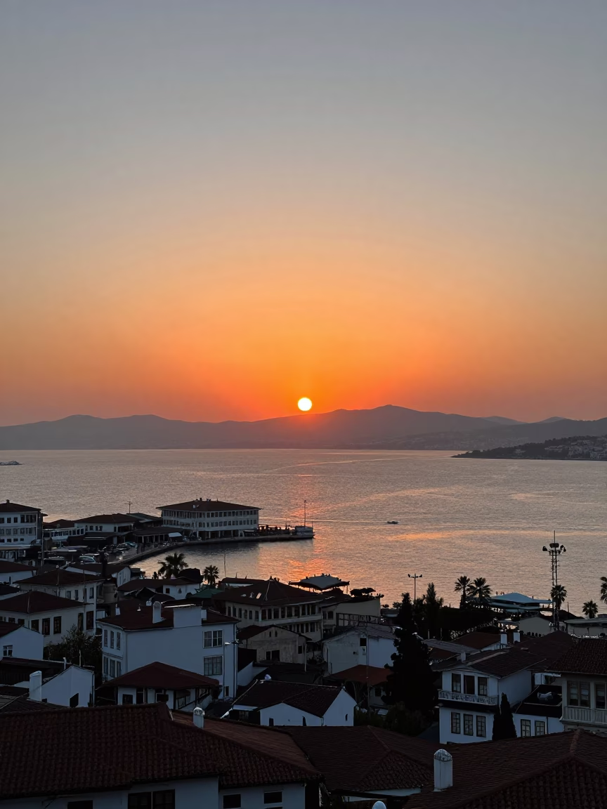 Sunset view of Izmir harbor and Kemeraltı bazaar district with traditional Turkish tea service in in Izmir, Turkey