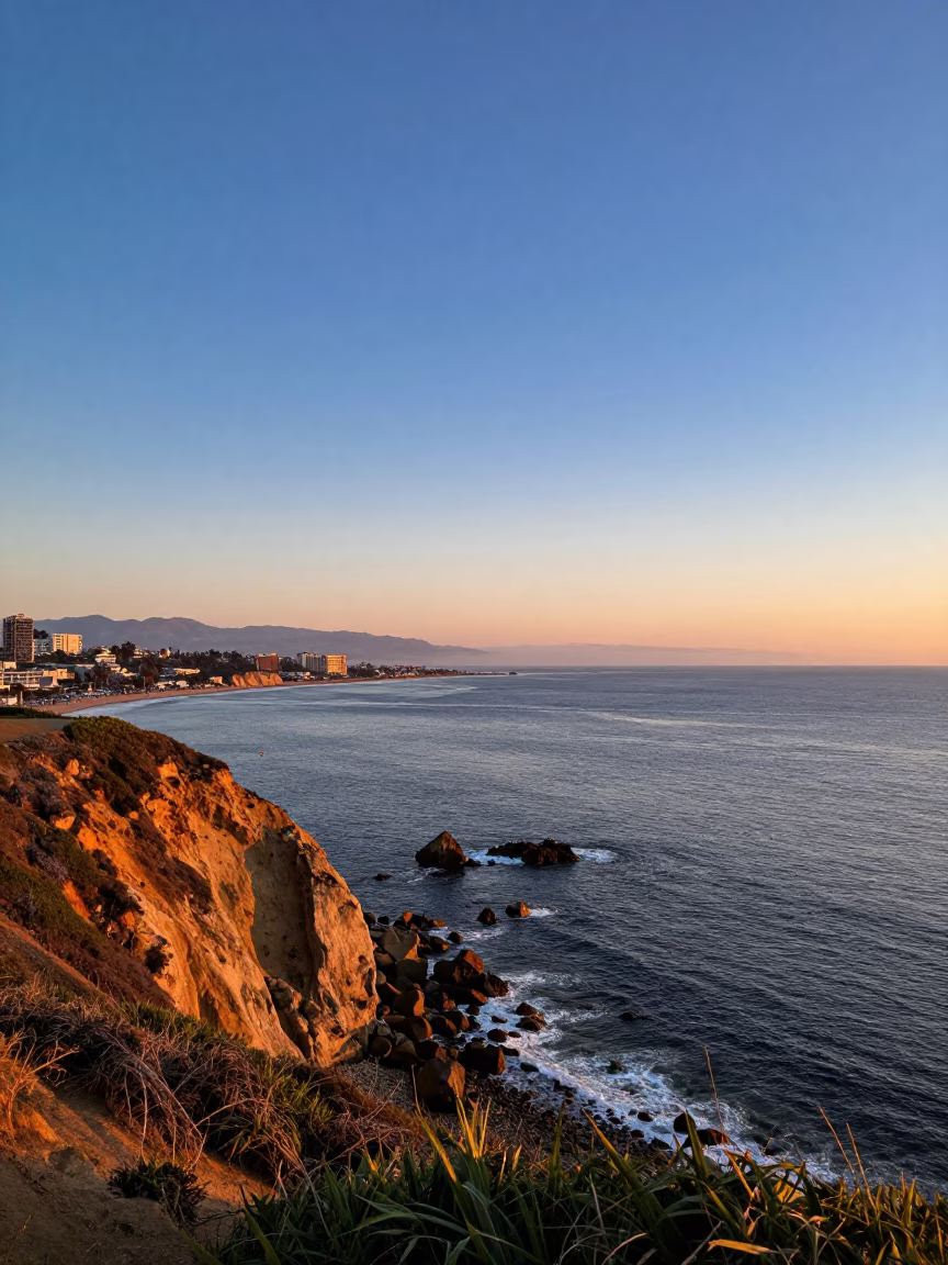 Sunset view of San Diego Bay with coastal cliffs and distant skyline in in San Diego, California, United States