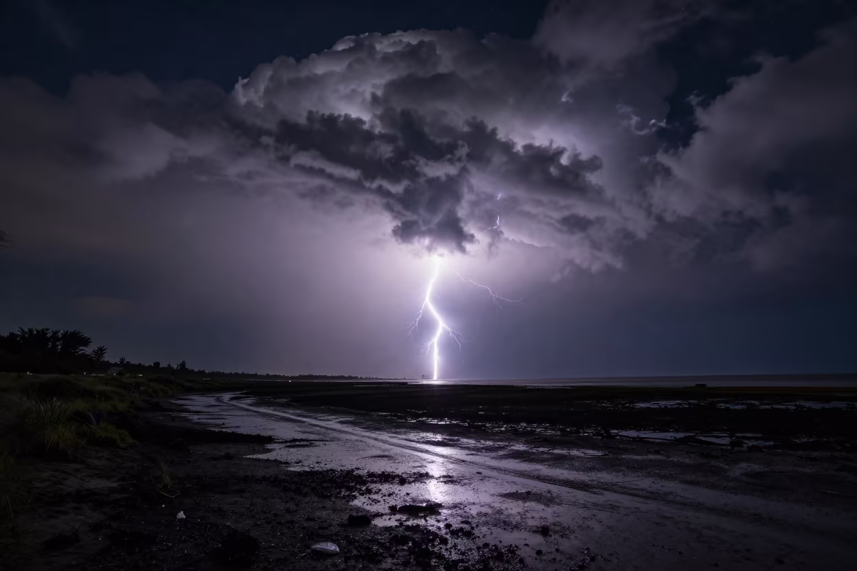 Supercell Lightning Over Ile Ife at Night in beneath thin cloud gaps and stars near Ile Ife