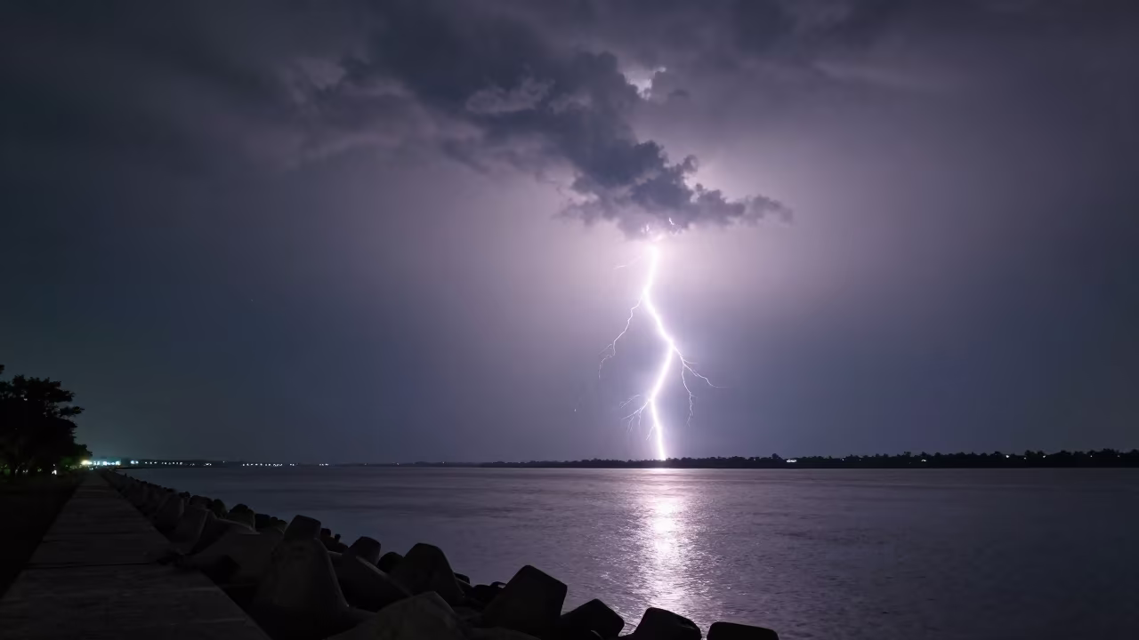 Supercell Lightning Over Lucknow Breakwater in from a moonlit breakwater near Lucknow