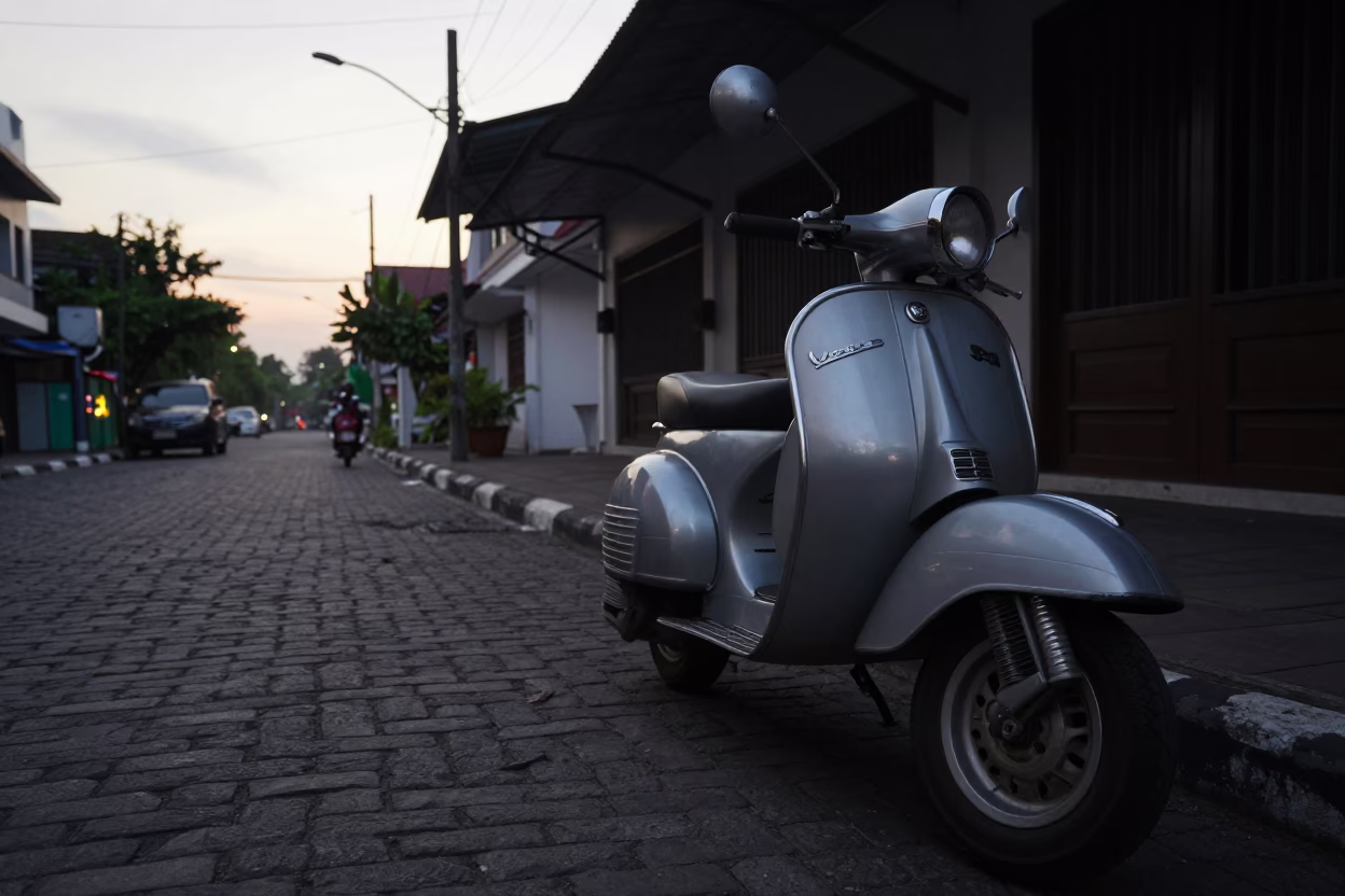 Surabaya Indonesia Pre-Dawn Street Scene with Vintage Vespa and Cobblestone Lane in in Surabaya, Indonesia