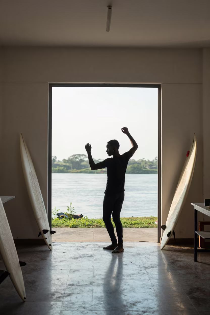 Surfer in Lubango Atelier Under Skylight in in an atelier in Lubango