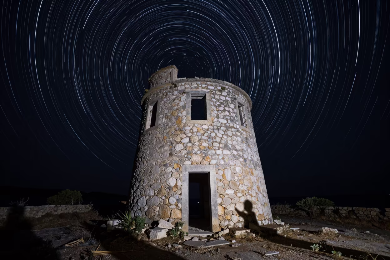 Surreal Star Trails Over Balearic Watchtower Night in in the Balearic Islands