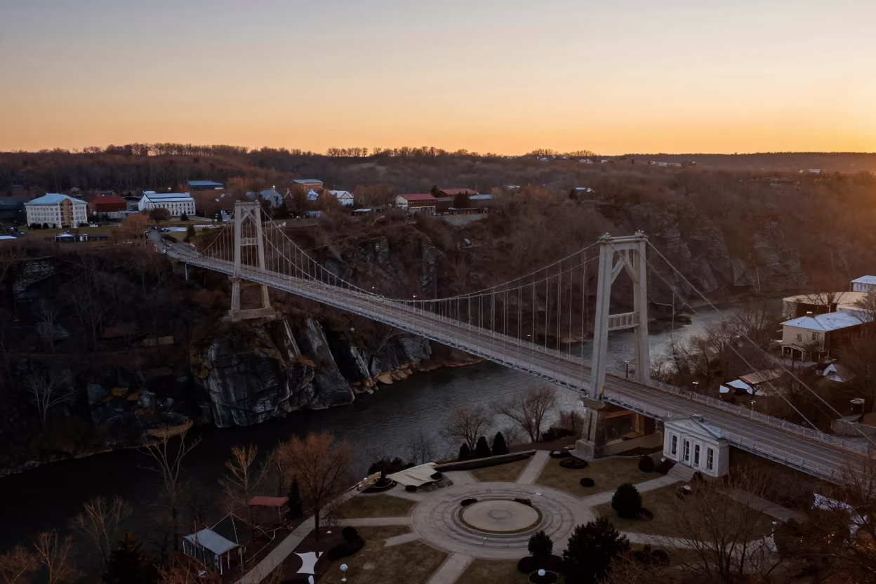 Suspension Bridge Over Kentucky Fjord at Sunset in across a formal civic plaza in Kentucky