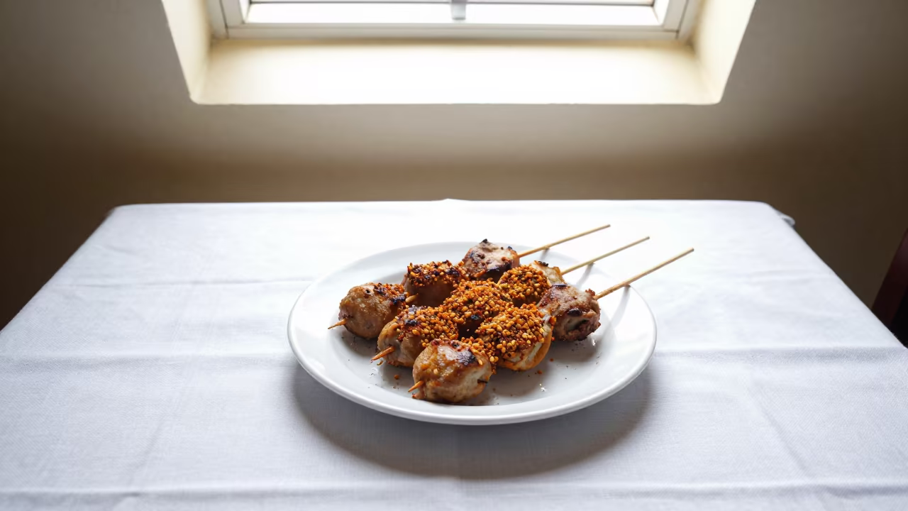 Suya Skewers Groundnut Spice Vidisha Table in on a linen-covered restaurant table in Vidisha