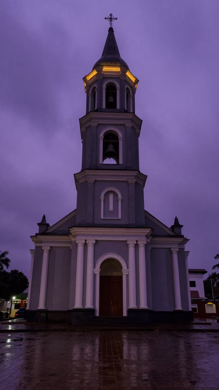 Swaying Bells on Twilight Mwanza Tower in along a colonnaded facade in Mwanza