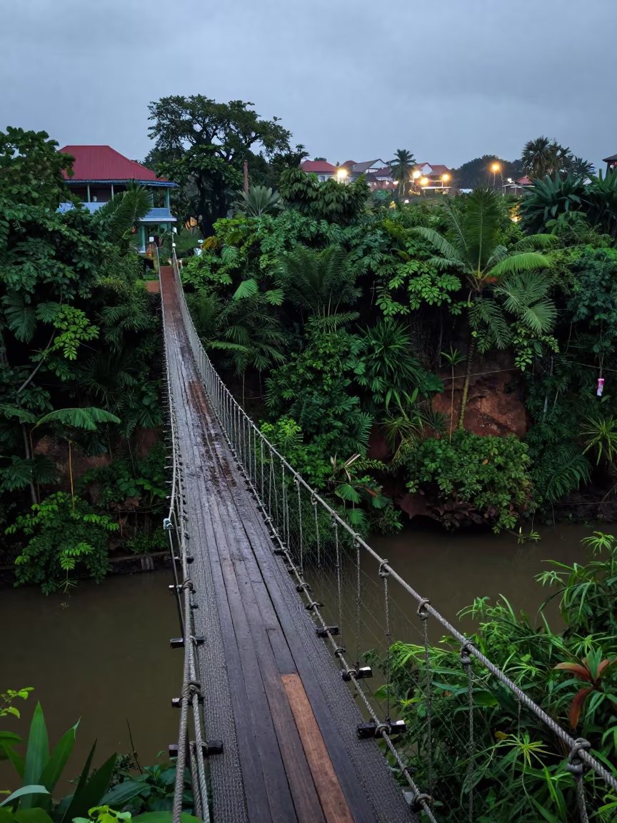 Swaying Rope Bridge Over Jungle Gorge at Dusk in near Phnom Penh