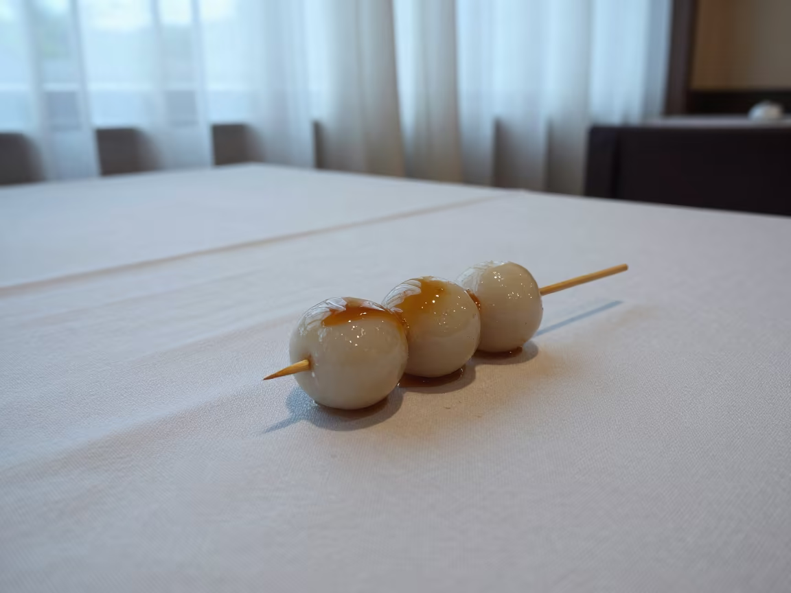 Sweet Soy Glazed Dango Skewer on Linen Table in on a linen-covered restaurant table in Bhagalpur