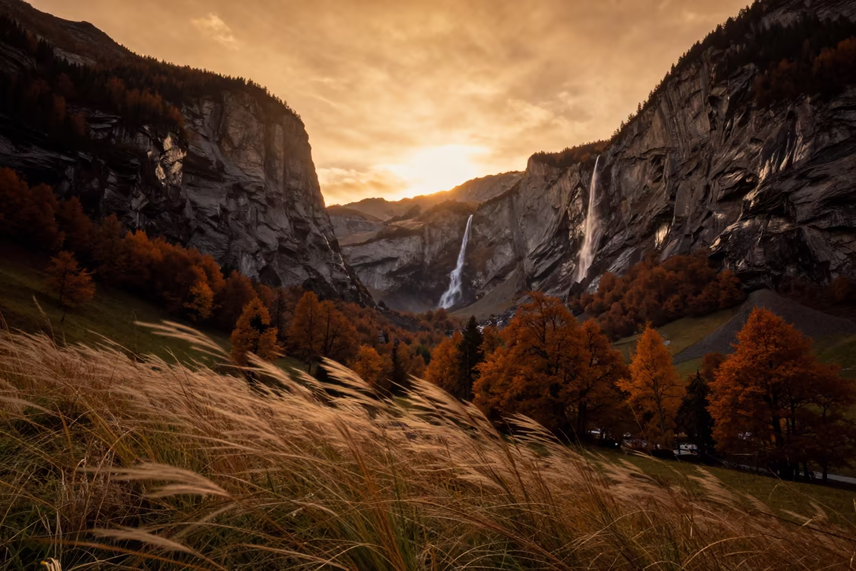 Swiss Hanging Valley Waterfall Amber Autumn Sunset in across a wide valley floor in Switzerland