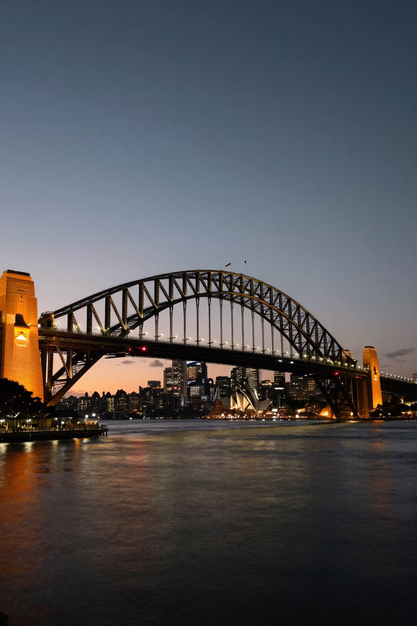 Sydney Bridge Illuminated at As City Lights Begin To Glow in in Sydney, New South Wales, Australia