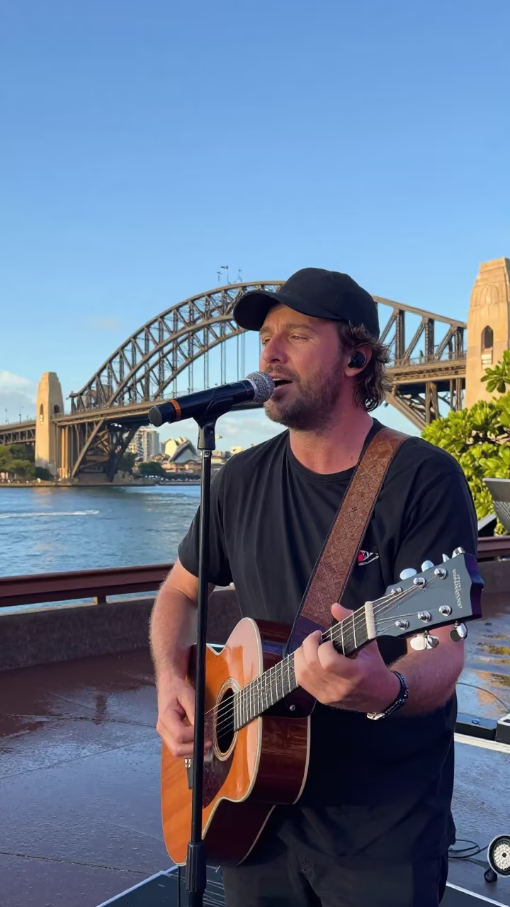 Sydney Busker Folk Guitar on Stage After Rain in on a festival main stage in Sydney
