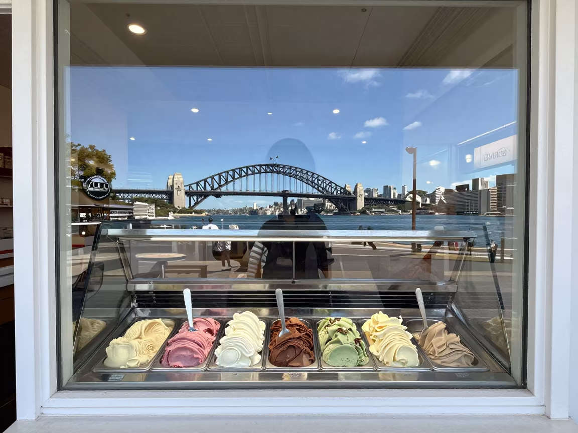 Sydney Gelato Shop Window Midmorning Harbor Light in outside a lit retail frontage after dark in Sydney