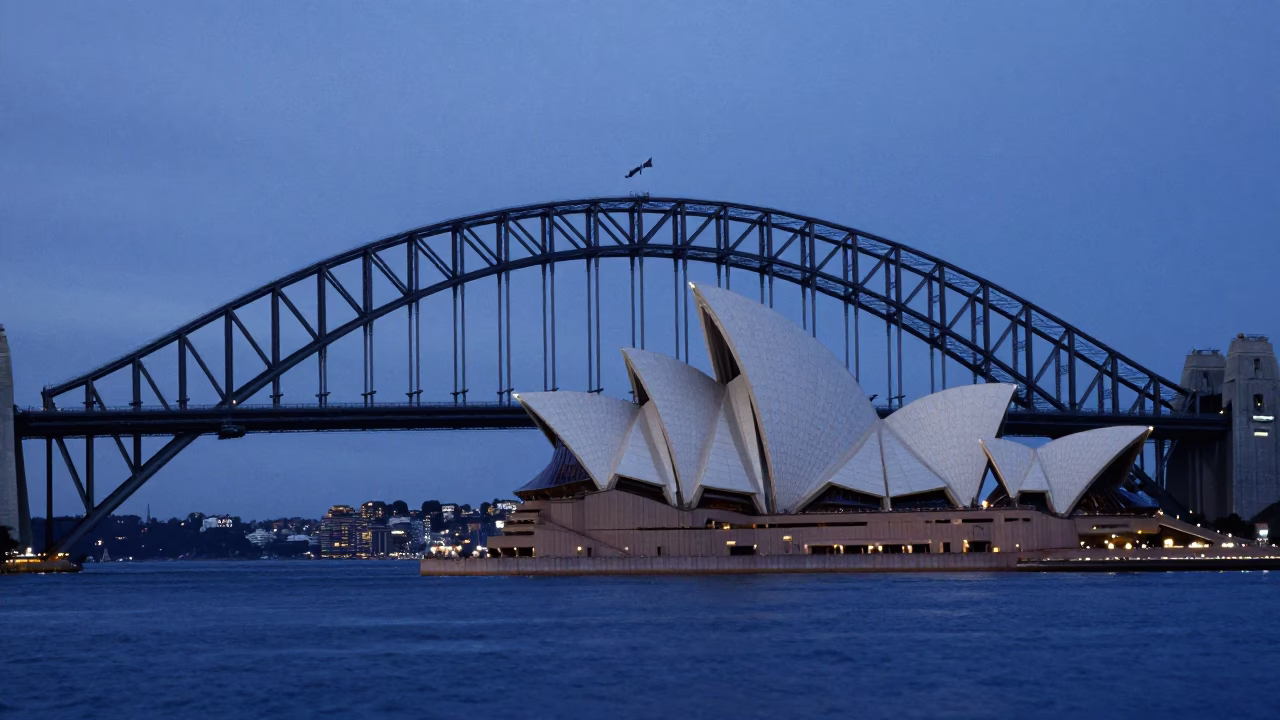 Sydney Harbour Bridge and Opera House at Dawn with Rowing Boat in in Sydney, New South Wales, Australia
