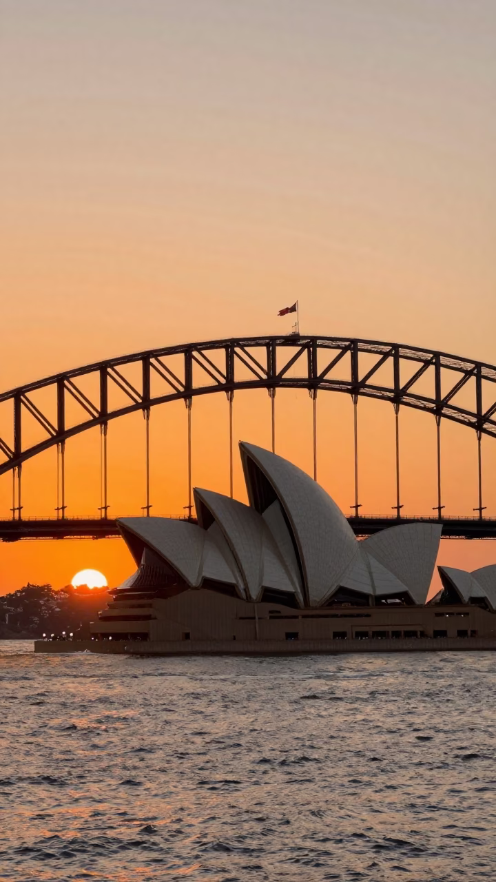 Sydney Harbour Bridge and Opera House at Sunset with City Lights in in Sydney, New South Wales, Australia