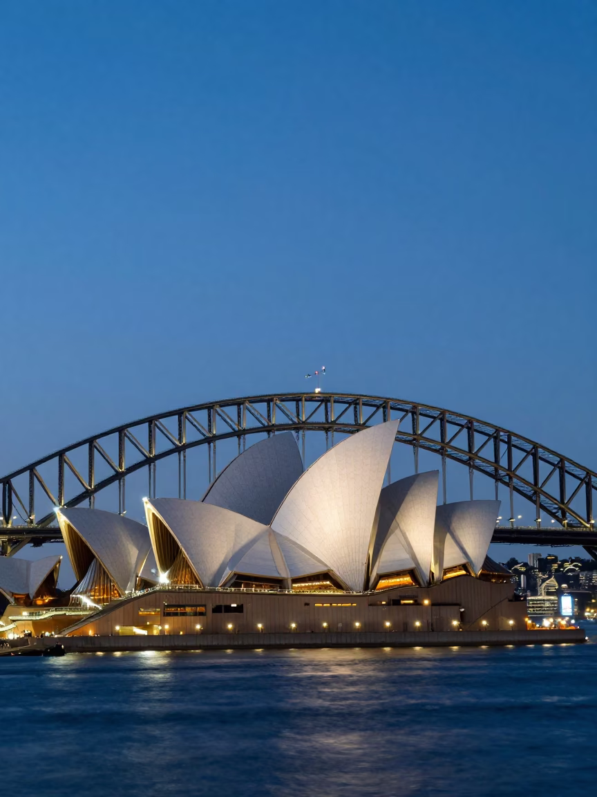 Sydney Harbour Bridge and Opera House at Twilight with Busy Circular Quay Street Scene in in Sydney, New South Wales, Australia