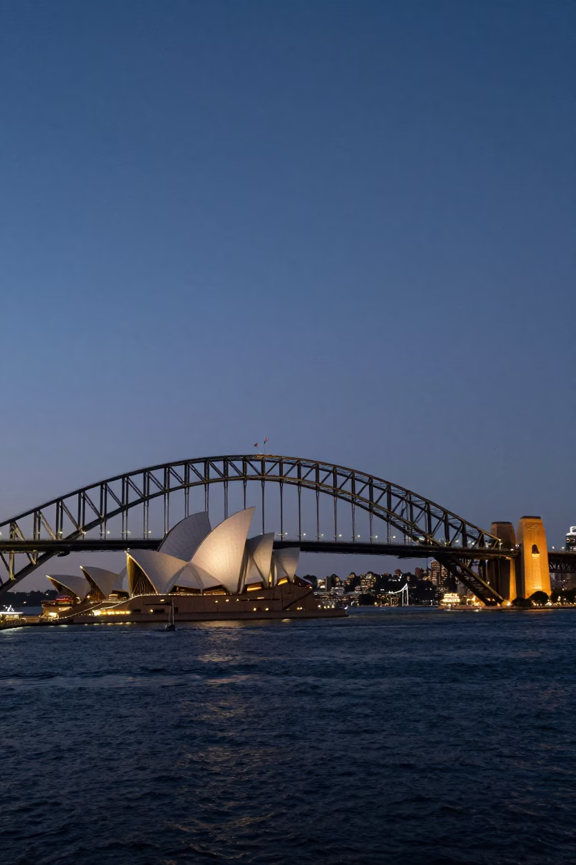 Sydney Harbour Bridge and Opera House Twilight View from Circular Quay Promenade with Commuters in in Sydney, New South Wales, Australia