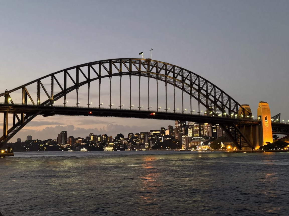 Sydney Harbour Bridge at As City Lights Begin To Glow in in Sydney, New South Wales, Australia